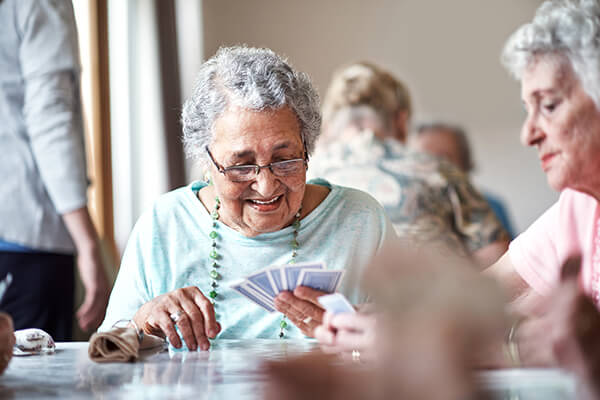 Senior women playing cards.