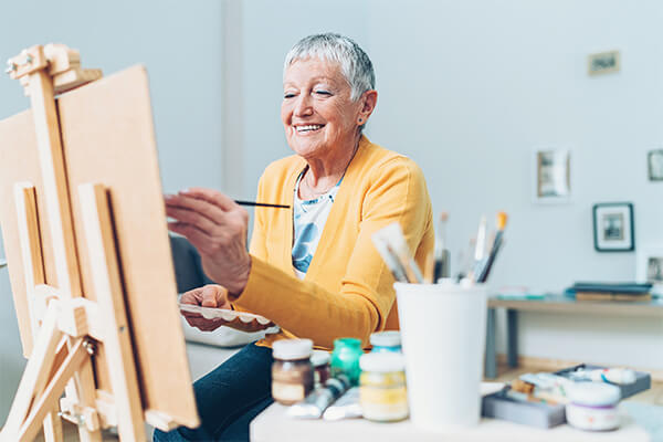 Senior woman painting.